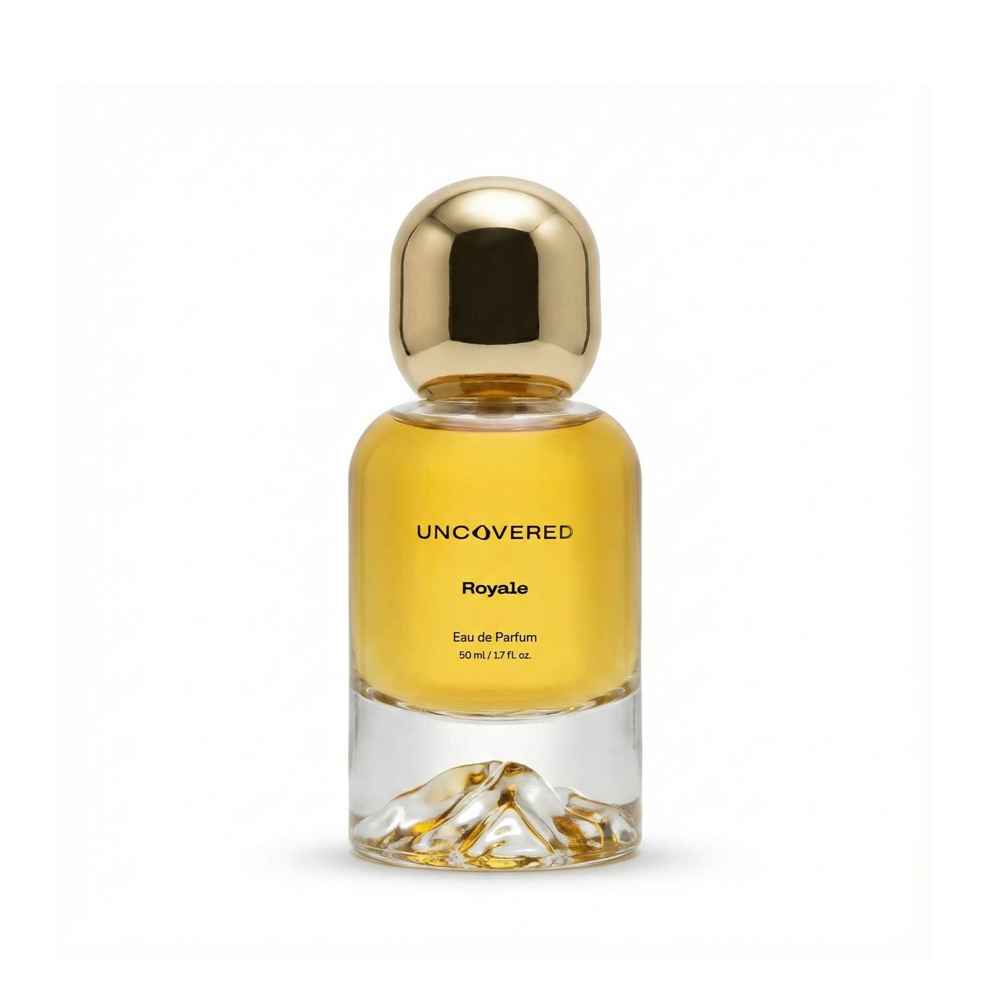 Perfume bottle labeled 'Uncovered Royale' with a gold cap on a white background